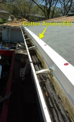 Gutter apron on a roof